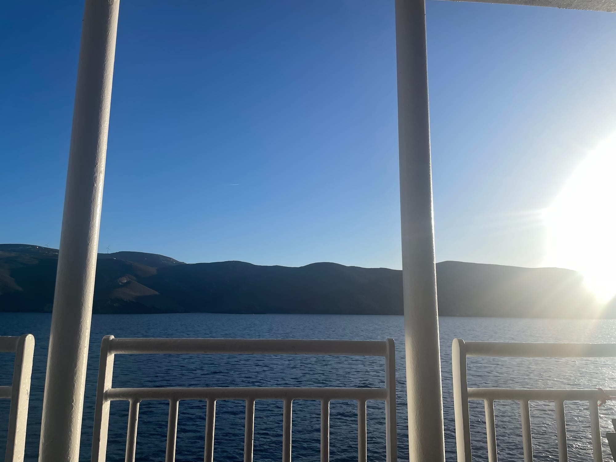 A photo of Syros island taken just before sunset from a ferry from Syros to Athens.