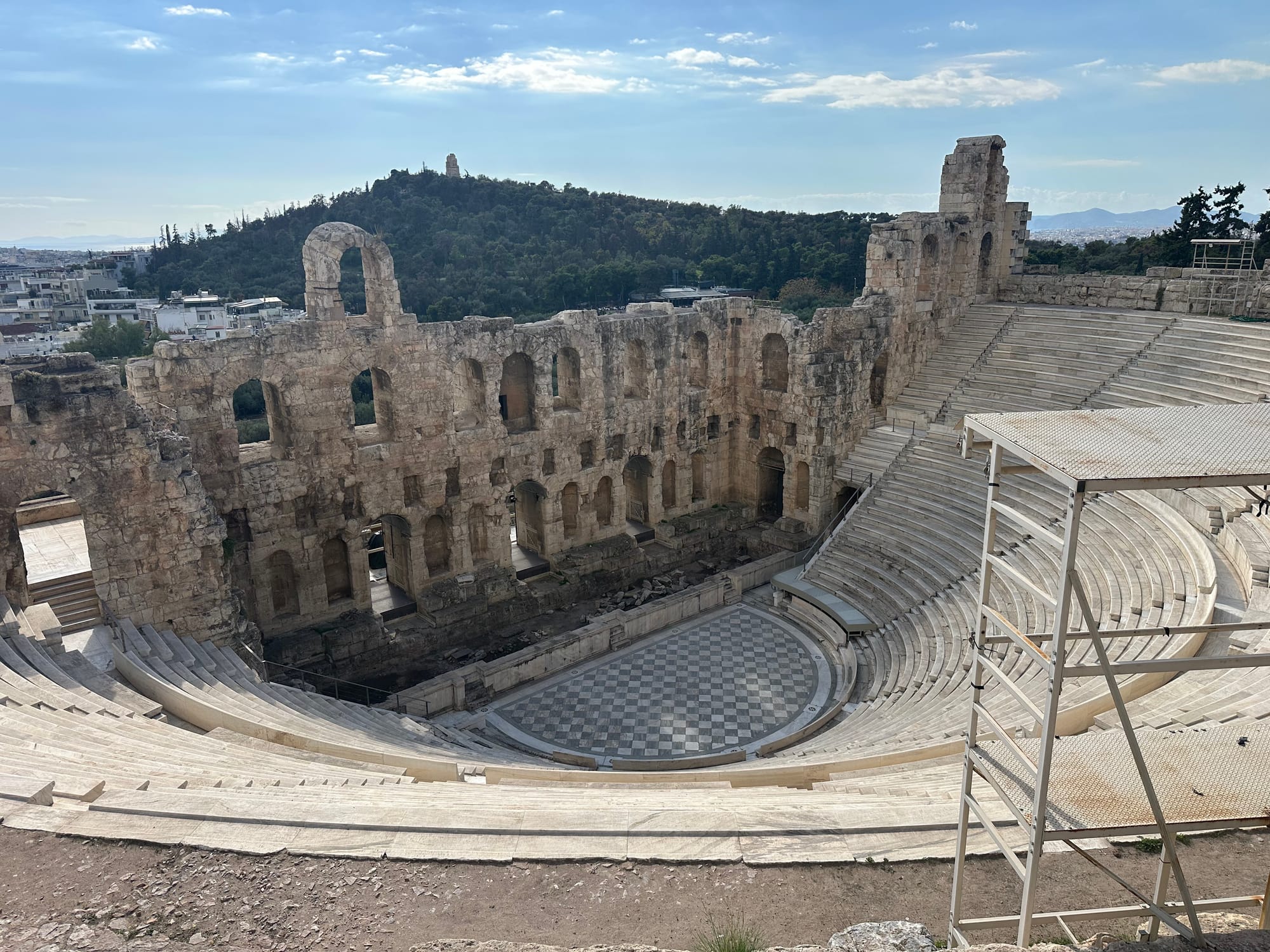 A photo of the Odeon of Herodes Atticus from the Acropolis' hill.