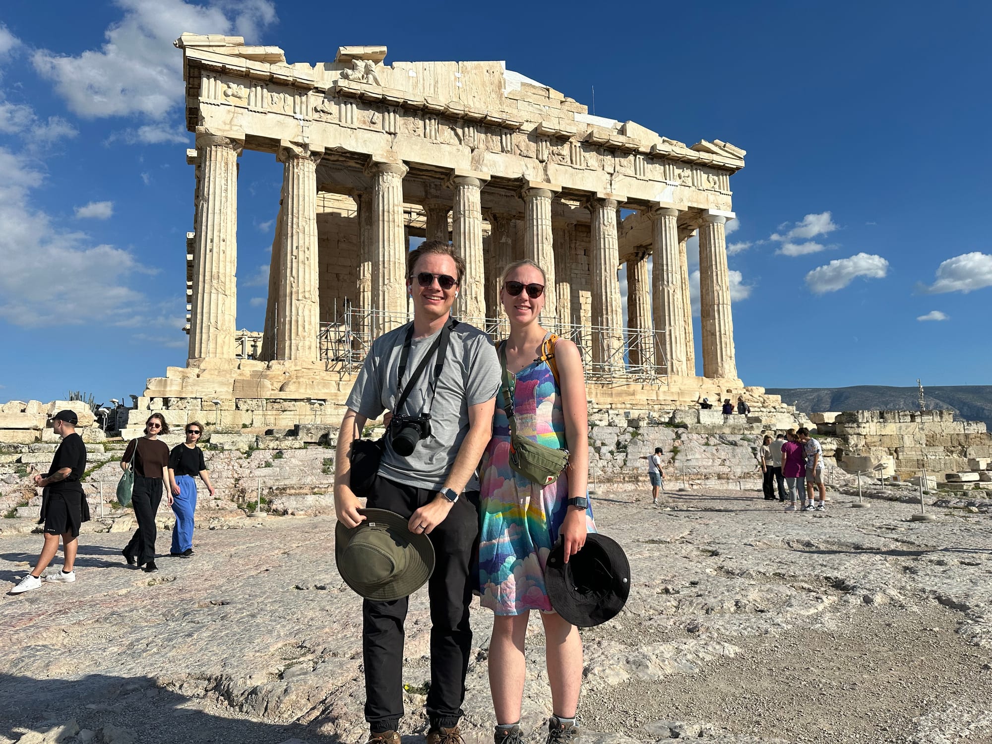 A photo of Rachel and Johann standing in front of the Parthenon.