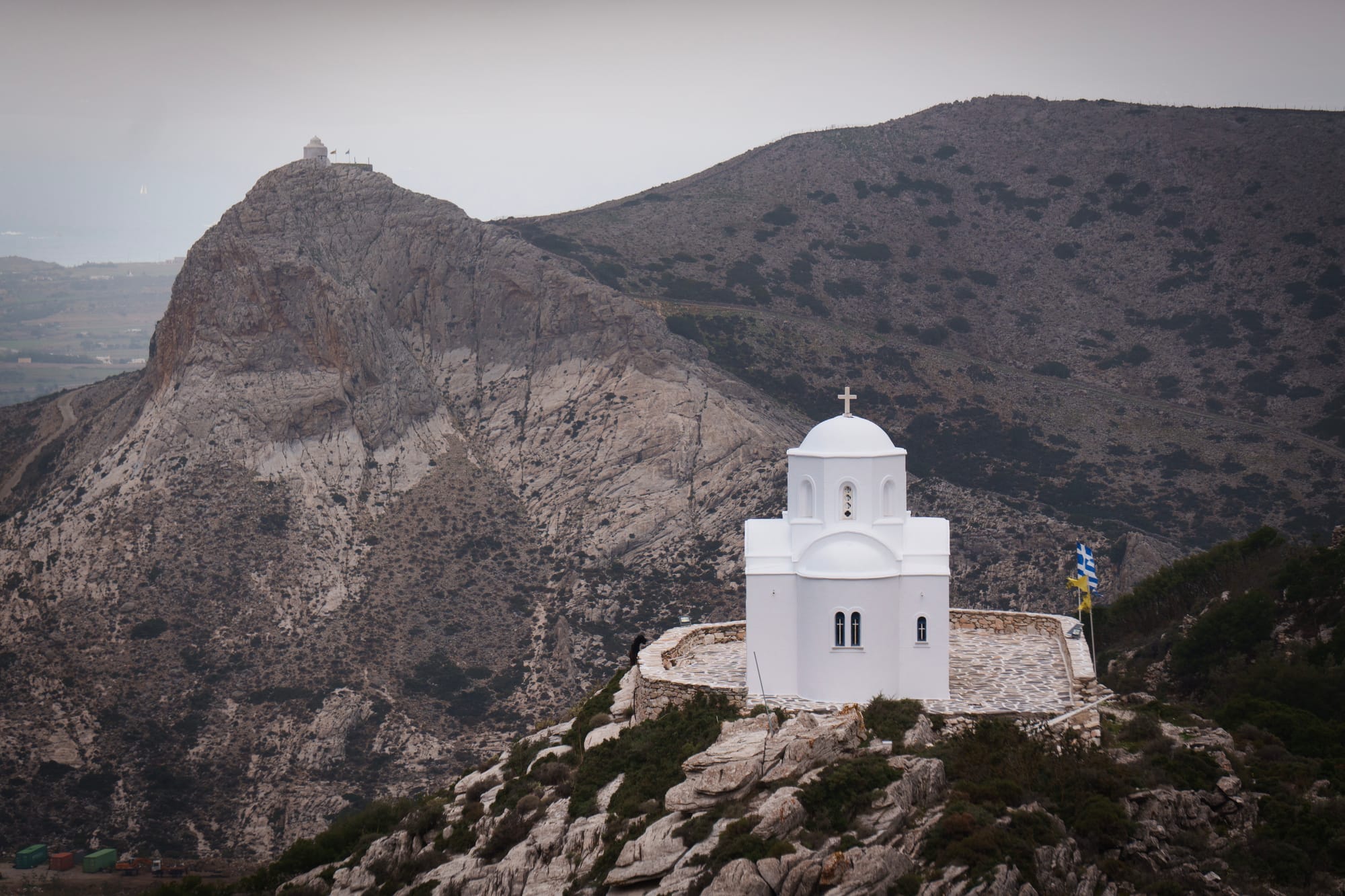 A photo of two small hilltop white churches near the village of Filoti on Naxos Island.