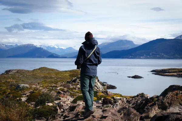 Rachel standing on top of an island nearby Ushuia, Argentina, looking out over the inlet.